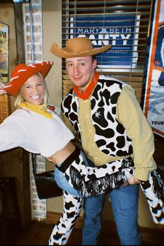 a man and woman dressed in cowgirl costumes