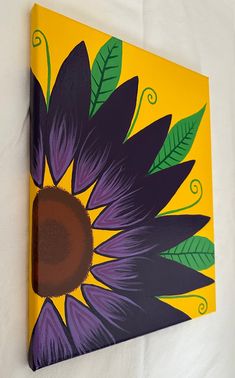 a painting of a purple and yellow flower on a yellow background with green leaves in the center