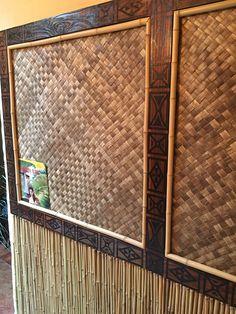 a close up of a bamboo wall with pictures on the front and back panels,