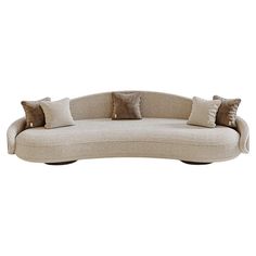 a curved couch with pillows on it