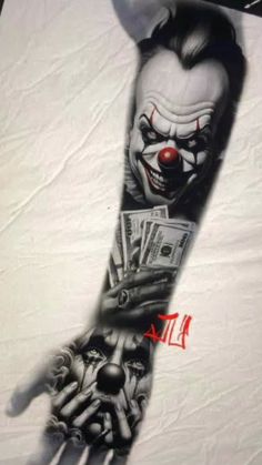 a hand with money on it and a clown's face painted on the arm