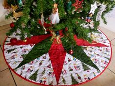 a christmas tree skirt with ornaments on it