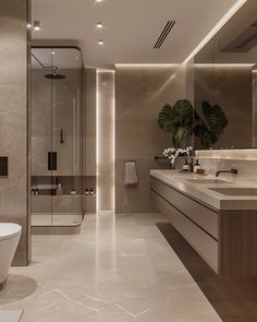 a modern bathroom with marble floors and walls