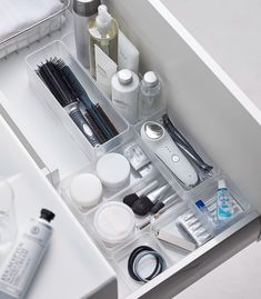 an organized drawer in the bathroom is shown