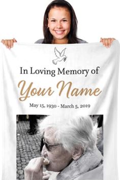 a woman holding up a white banner with the words in loving memory of your name