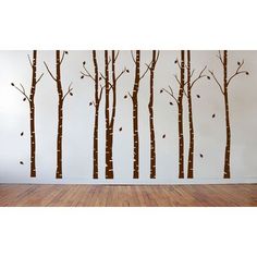 the wall decals are painted with brown trees