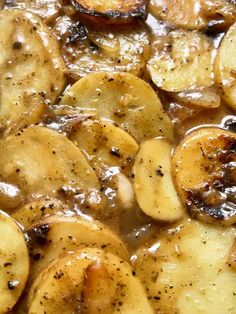 cooked bananas and onions are in a brown gravy