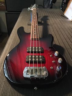 an electric guitar sitting on top of a table