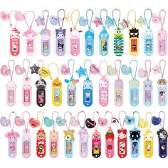 an assortment of cartoon cell phones with keychains attached to each one's sides