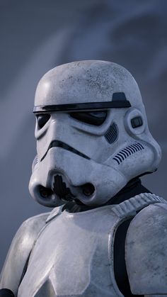 a star wars helmet is shown in front of a dark background with the image of a stormtrooper