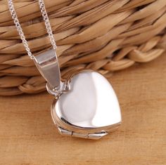 This is solid 925 sterling silver heart shape photo picture locket pendant. 925 stamped. The locket is plain highly polished on both sides.    Approx. measures:             total length: 24mm           without bail: 17mm            width: 16mm     Approx. pendant only weight: 2.8grams      Available on its own or with various length  (16-30 Inch) 1mm curb chain, please choose from the drop- down menu at the top of the page. Both locket pendant and chain are solid sterling silver. Presented in gi Classic Silver Heart Locket Necklace, Classic Heart Shaped Sterling Silver Locket Necklace, Classic Sterling Silver Heart Locket Necklace, Classic Heart-shaped Sterling Silver Locket Necklace, Heart Shaped Hallmarked Silver Locket Necklace, Silver Heart Pendant Locket Necklace With Polished Finish, Heart Shaped Locket Necklace With Polished Finish As Gift, Silver Heart Locket Necklace Classic Style, Italy Jewelry