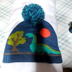 Brand New Never Worn Dino Hat Casual Hats For Playtime, One Size Fits Most, Casual Beanie For Playtime, Outdoor Blue Knitted Beanie, Blue Outdoor Beanie Hat, Fun Green Hat For Playtime, Outdoor Blue Beanie Hat, Warm Blue Cap, Blue Winter Hats One Size Fits All, One Size Blue Beanie Cap