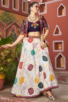 Celebrate the spirit of Navratri in style with our Lehenga Choli with Jacket ensemble, designed to make you stand out during the festive season! This elegant readymade outfit features a stunning combination of Viscose Rayon for the top and jacket, ensuring both comfort and a luxurious drape. The Art Silk lehenga offers a beautiful flow, perfect for twirling on the Garba dance floor. The intricate embroidery work on the waist belt and charming latkan details add a touch of sophistication, while t Kids Kurta Pajama, Garba Outfit, Navratri Lehenga, Purple Lehenga, Vibrant Outfits, Navratri Chaniya Choli, Bollywood Lehenga, Party Wear Gown, Lehenga Choli Online