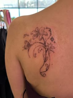 a woman with a tattoo on her back