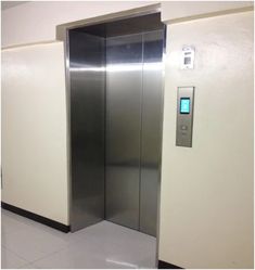 an empty elevator with the door open