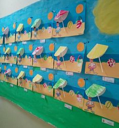 a bulletin board with umbrellas and beach chairs on it's sides in a classroom