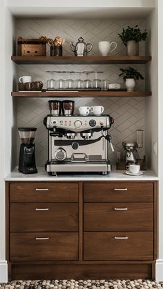 an espresso machine sitting on top of a wooden dresser next to shelves filled with cups