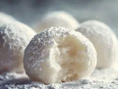 powdered sugar covered donuts on a table