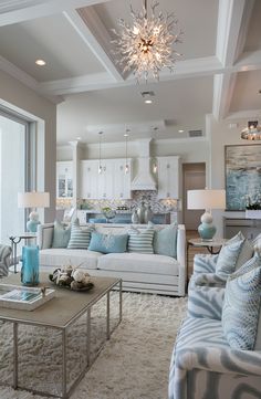 a living room filled with furniture and a chandelier