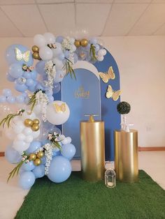 balloons and flowers are on display in front of a backdrop