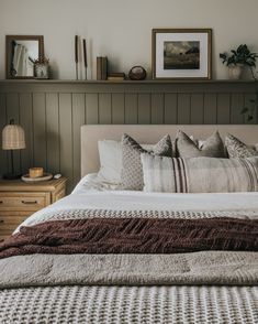 An aesthetic bedroom that has half of a green wall shelf with various accessories on it with one framed print. The bed has multiple layered blankets and pillows. Beige Bed, Cottage Bedroom, Spare Bedroom, Master Bedrooms Decor, Kantha Quilt, Bedroom Inspo, My New Room, New Room, Guest Bedroom