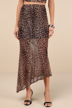 Hit the town with a bold vibe everyone will love in the Lulus Fierce Charm Brown Leopard Print Mesh Asymmetrical Midi Skirt! Stretchy mesh knit boasts a trendy leopard print as it shapes this fashion-forward skirt with a high-rise fit and an elasticized waistband. Figure-skimming silhouette features asymmetrical seaming before falling to a sheer, asymmetrical midi hem. Pair with the matching top for a complete look! Fit: This garment fits true to size. Length: Ankle length. Size medium measures Asymmetrical Midi Skirt, Brown Leopard, Asymmetrical Skirt, Matching Top, Stretchy Fabric, Fitness Inspo, Custom Fit, Ankle Length, Two Piece Skirt