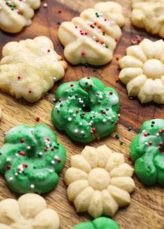 green and white cookies with sprinkles on a cutting board