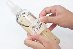 someone is holding an empty bottle with the word anti - spay written on it