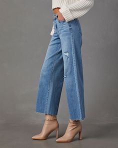 These wide leg jeans are a 10 out 10! The Camala has distressed details all over, a high rise and raw hem. We love that it's complete with five classic pockets and a good amount of stretch for that comfy, wear-all-day feeling. Style it with your favorite fall sweaters and boots! High rise Wide leg fit Distressed detailing & raw hem Front zip fly & button closure 5 Classic pockets 93% Cotton 5% Polyester 2% Spandex Runs Large Fall Medium Wash Jeans With Frayed Hem, Distressed Cutoff Flare Jeans For Fall, Wide Leg Cropped Jeans With Frayed Hem For Fall, Fall Wide Leg Cropped Jeans With Frayed Hem, High Rise Denim Jeans With Frayed Hem, Cutoff Denim Jeans For Fall, Straight Leg Cropped Jeans With Frayed Hem For Fall, Fall Straight Leg Cropped Jeans With Frayed Hem, Denim Flare Jeans With Frayed Hem For Fall