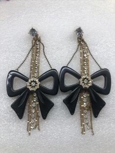 Betsey Johnson Rocker Chic Bow Rhinestone Chain Earrings Rare | eBay Chain Dangle Earrings For Party, Dangle Chain Earrings For Party, Jeweled Metal Earrings For Evening, Jeweled Clip-on Earrings For Evening, Black Jeweled Earrings For Party, Vintage Single Earring For Party, Trendy Party Earrings With Chain Detail, Party Earrings With Metal Chain, Evening Metal Chain Earrings