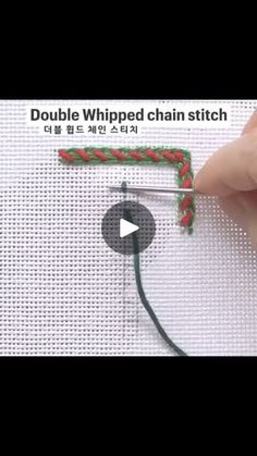 someone is stitching a red and green ribbon on a white piece of fabric with the words double whipped chain stitch