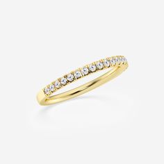 a yellow gold wedding band with white diamonds