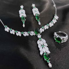 Exquisite Emerald Jewelry Set - Elegant and Luxurious Radiant Zirconia Necklace, Ring, Bracelet, and Earrings for Holiday Glamour ✧ A delicate jewelry set can complement your entire look, this jewelry set not only suitable for everyday wear, but also for formal occasions such as banquets, wedding party, theme parties ✧ This dainty jewelry set is a very special gift for birthday, Mother's Day, Valentine's Day and more  ✧ Comes with an exquisite gift box Materials: Environmentally-friendly Copper Earring Needle Materials: 925 Sterling Silver ✰Necklace Necklace Length : 17.7in+1.97in Necklace Weight: 18.4g Pendant Size: 68mm*15mm ✰Bracelet Bracelet length: 18.4mm Bracelet weight: 14.9g Bracelet main stone: 10mm*10mm ✰Ring Open Ring Main Stone: 10mm*10mm     Ring Weight: 4.4g ✰Earring  Earring May Birthstone Party Jewelry, Fine Jewelry For Parties With Emerald Accents, Fine Jewelry For Party With May Birthstone, Fine Jewelry For Party With Emerald, Green Crystal Jewelry Sets With Jewels, Green Gemstone Jewelry Sets For Wedding, Wedding Green Gemstone Jewelry Set, Green Crystal Jewelry For May Birthstone, Green Crystal Fine Jewelry