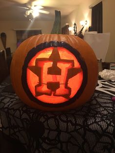 a pumpkin carved to look like a star wars symbol