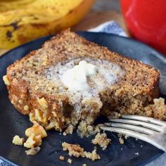 a piece of banana bread on a plate with a fork