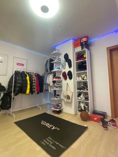 a room filled with lots of shoes and sports equipment