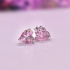 Size : 8 mm x 8 mm Main Stone Size : 8 mm x 8 mm (2 Carat / each) Main Stone Color : Pink Main Stone Shape : Heart Cut Metal : Real Solid 925 Sterling Silver Hallmark : 925 Stones Setting : Prong Finish : High Polished Guaranteed High Quality Comes in a beautifully wrapped gift box Heart Cut 2 Carat Champagne Pink Sapphire Stud Earrings 925 Sterling Silver Stud Earrings Pink Heart Shaped Wedding Earrings Round Cut Cubic Zirconia Heart Earrings For Gift, Heart Cut Cubic Zirconia Earrings As Gift, Heart-shaped Earrings For Mother's Day Formal, Silver Diamond Cut Heart Earrings, Pink Sterling Silver Heart Earrings For Mother's Day, Sterling Silver Heart Earrings For Formal Occasions, Pink Heart Cut Earrings For Formal Occasions, Classic Hallmarked Earrings For Valentine's Day, Formal Heart Cut Earrings