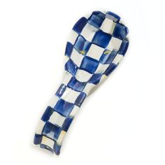 a blue and white checkered glass object on a white background