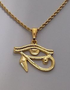 Gold 24 kt Eye of Horus Charm Necklace ☆ Wedjat Eye | Eye of Ra ☆ Eye of Horus Necklace | African Jewelry ☆ For Him or Her | Protection Amulet ☆ 24 kt Gold Plated Eye of Horus measures 1.25 inches wide by 1 inch high ☆ Strung on a gold snap-on bail. CHOOSE YOU CHAIN from our pull-down menu: ☆ A 45cm/ 17.7 inch long 2 mm wide gold ROPE chain with lobster clasp. OR ☆ A 50cm/19.7 inch long 2 mm wide gold ROPE chain with lobster clasp. OR ☆ A 22 inch long 2 mm wide gold ROPE chain with lobster clasp Gold Egyptian Jewelry, Gold Spiritual Charm Necklace, Gold Ankh Necklace With Adjustable Chain, Gold Ankh Necklace Gift, Gold Ankh Necklace For Gift, Gold Ankh Chain Necklace, Gold Ankh Metal Jewelry, Gold Pendant Jewelry Cadmium-free, Gold Ankh Shaped Metal Jewelry