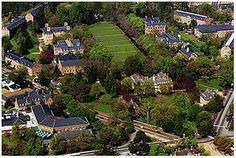 an aerial view of a large estate surrounded by trees