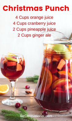 christmas punch recipe in a pitcher with orange slices, cranberry juice and 2 cups ginger ale