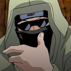 a person in a hoodie holding up a cell phone to their face with both hands