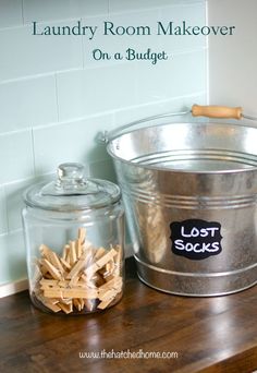 a metal bucket with wooden clothes pins in it