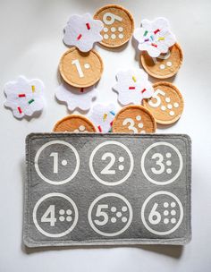 there is a felt board with buttons and numbers on it