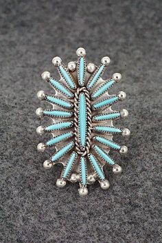 This turquoise and sterling silver ring was made by Zuni silversmiths Lance and Cordelia Waatsa. The back is signed LC Waatsa, Zuni and sterling. Size: 5.75 Length: 1 5/8" Width: 1" Free shipping on all orders! We ship with USPS and always include tracking. All orders ship within a day of payment. Returns are accepted up to 30 days after you receive your order. Just send us a message. Our shop offers cash back or store credit. The item must be returned in new condition. Native American Jewelry, Turquoise Sterling Silver, Free Jewelry, Belt Buckles, Sterling Silver Ring, Sterling Silver Rings, Silver Ring, Jewelry Rings, Silver Rings