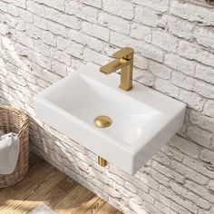 a white sink sitting next to a brick wall