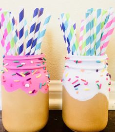 two mason jars filled with paper straws and sprinkles