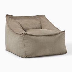 a brown bean bag chair sitting on top of a white floor