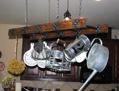 pots and pans are hanging from the ceiling