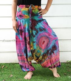 "💥One Size Fits Most Comfortable Low Cut Drop Crotch Tie Dye Harem Pants, Hippie Pants, Tie Dye Baggy Pants, Festival Harem Pants, Festival Clothing, Tye Dye Genie Pants, Tie Dye Comfy Pants 👉Fabric: Soft and Breathable Rayon 👉Smocked Elasticated Waist: 26\" up to 54\" 👉Hips up to: 60\" 👉Total Length: 39\" (Top to Bottom) 👉 Around elastic ankle 10\" 👉 Tie Dye Method 👉 One Size Fits M-XL or US 2-20 👉Extremely Comfortable 👉Boho/Hippie Theme, Beach Wear/Festival Going Pants Note: Due to t Pink Baggy Harem Pants For Summer, Baggy Multicolor Pants For Summer, Relaxed Fit Harem Pants For Summer Festivals, Hippie Relaxed Fit Harem Pants For Summer, Summer Hippie Relaxed Fit Harem Pants, Hand Dyed Cotton Bottoms For Summer, Hand Dyed Cotton Summer Bottoms, Pink Summer Harem Pants, Summer Hippie Harem Pants With Loose Fit